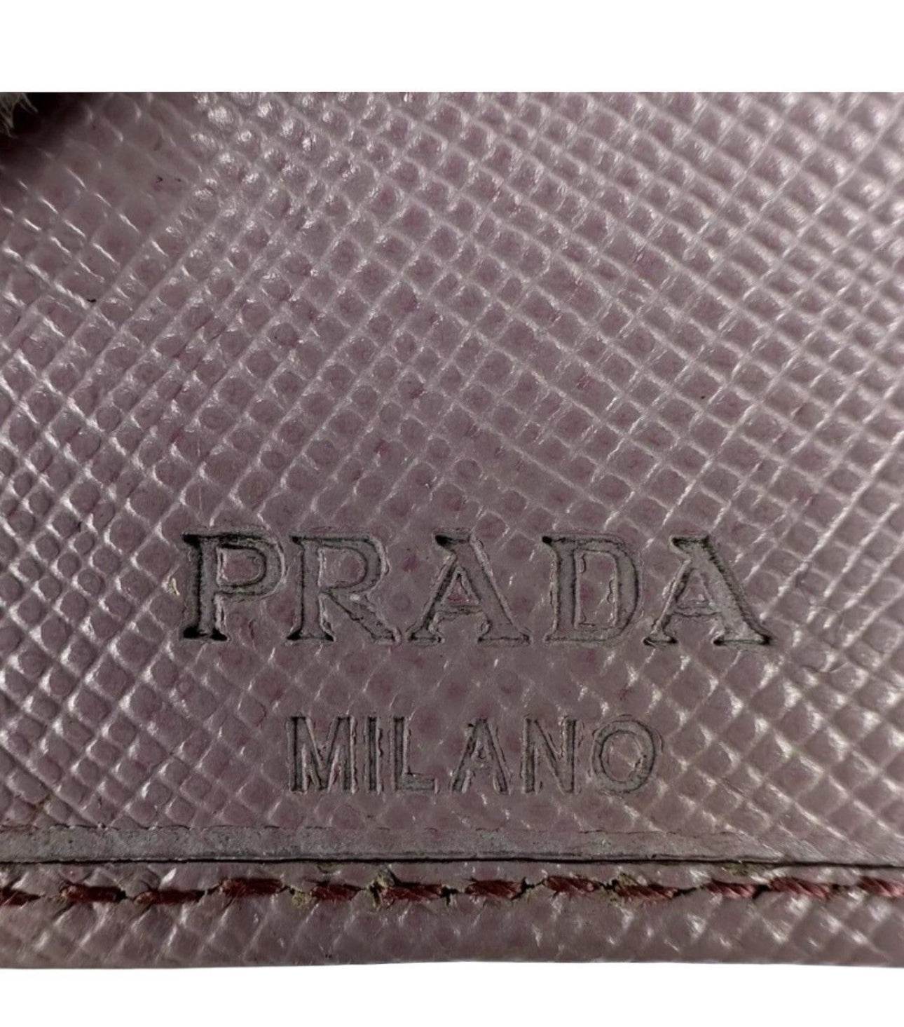 Prada Safiano Leather Pink Wallet for women in excellent used condition with Tra-angular metal Prada Logo - Luxbrandz