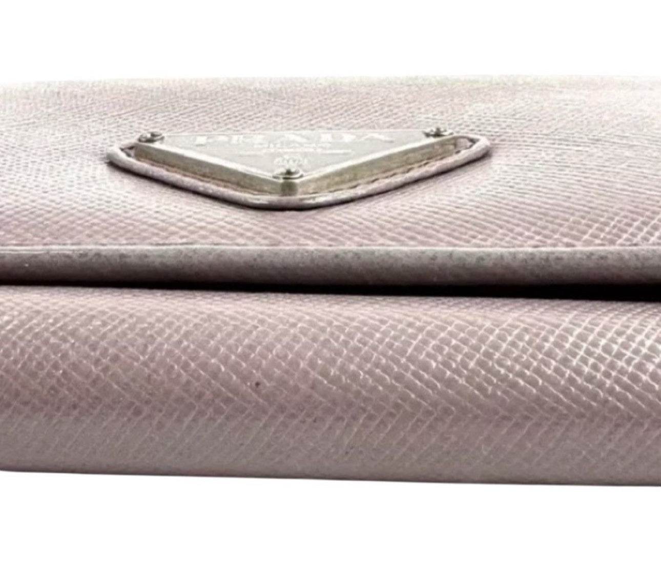 Prada Safiano Leather Pink Wallet for women in excellent used condition with Tra-angular metal Prada Logo - Luxbrandz